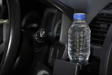 Drinking water in the car prepared for traveling