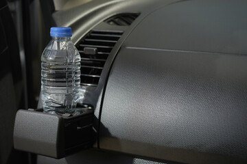 Drinking water in the car prepared for traveling