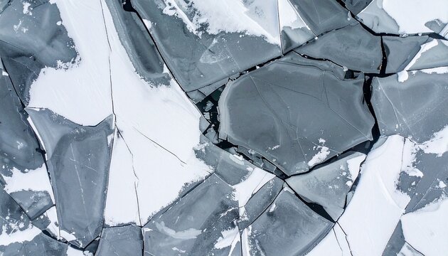 Breathtaking aerial view of cracked ice formations creating a stunning winter landscape, perfect for conveying themes of fragility, resilience, and the raw beauty of nature's artistry