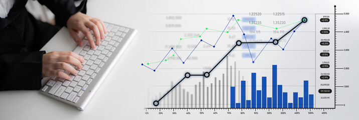A close-up of hands typing on a keyboard while analyzing data trends through various graphs and...