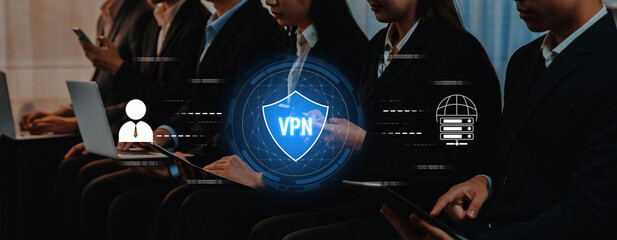 A diverse group of business professionals utilizes technology to emphasize security and privacy through VPN connections in a modern office environment. Trope