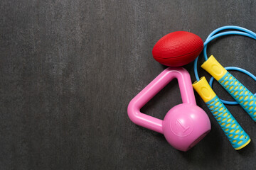 Time for exercising sport equipment on the black table background, healthy and workout concept
