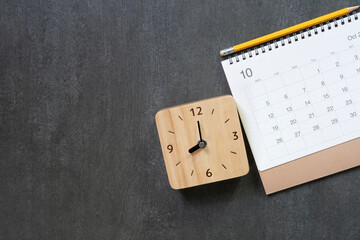 close up of calendar on the black table background, planning for business meeting or travel planning concept