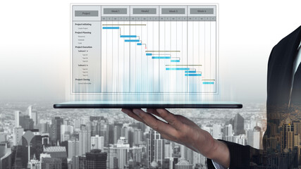 A businessman showcases a digital tablet displaying a project timeline and Gantt chart against a cityscape background, symbolizing modern project management strategies. Tessel