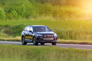 Fototapeta premium Family trip in a fast sport utility vehicle