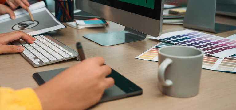 A vibrant creative workspace featuring a computer, graphics tablet, and various design tools. The image captures the essence of artistic collaboration and innovation. SACTR