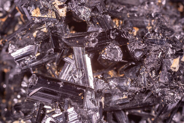Tourmaline black crystals. Gems. Mineral crystals in the natural environment. Texture of precious and semiprecious stones. Seamless background with copy space colored shiny surface of precious stones.