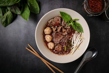 Thai Boat Noodles (Kuay Teow Reua) with Blood Soup, pork, Meatballs, and Basil