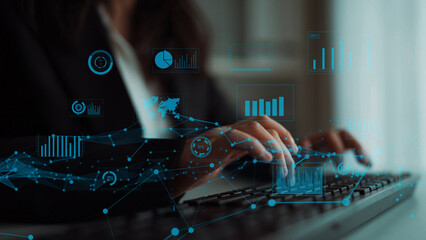 A business professional engages with a keyboard surrounded by digital data visuals, showcasing trends and insights in a contemporary office environment. Xenic