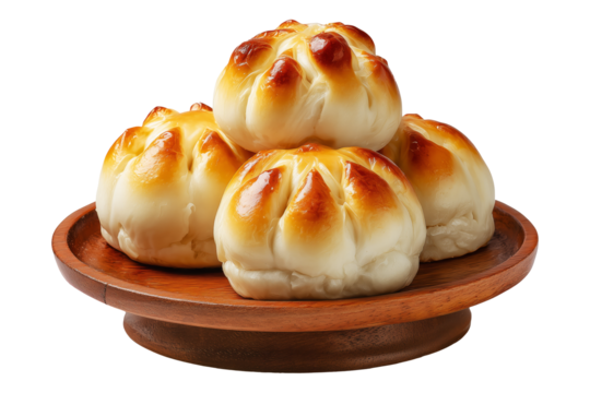 Panipopo sweet rolls baked in coconut milk with golden crust on wooden plate isolated on white transparent background, concept of bakery and food freshness