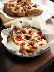 baked focaccia bread in round baking pan