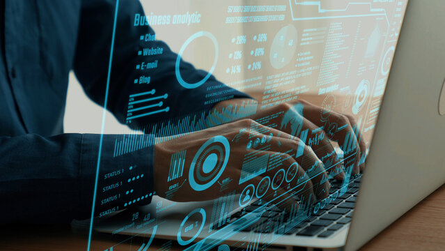 Close-up view of a person working on a laptop with digital business analytics overlay. The image highlights data integration for informed decision-making and strategic insights. Cipher