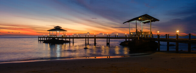 Stunning sunset view at Koh Kood Island Thailand with calm waters and serene pier