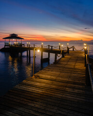 Fototapeta premium Stunning sunset view from a wooden pier on Koh Kood Island Thailand