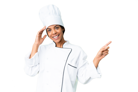 Young African American chef over isolated chroma key background surprised and pointing finger to the side