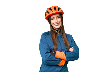 Young cyclist woman over isolated chroma key background with arms crossed and looking forward