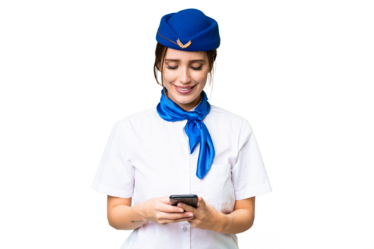 Airplane stewardess over isolated chroma key background sending a message with the mobile