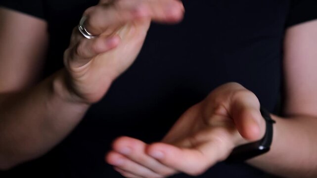 Fast clapping hands front view on black background. Applauding at the theatre or concert. Bravo. Congratulation gesture. Expression of emotions. Very good. Great show. A grateful viewer. 4K footage.