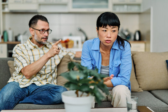 Two young people arguing at home, divorce fight marriage concept - Powered by Adobe