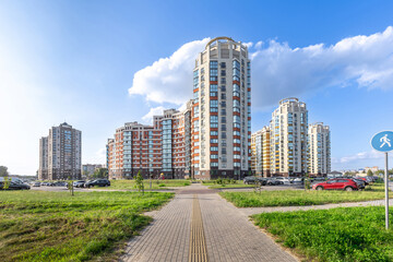 Fototapeta premium Modern Residential High-Rise Buildings Under Blue Sky