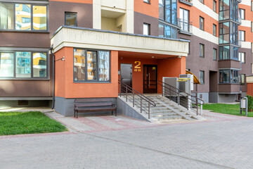 Accessible Entrance to Modern Residential Building with Ramp and Lift