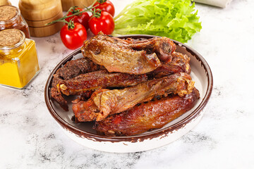 Roasted duck wings with sauce