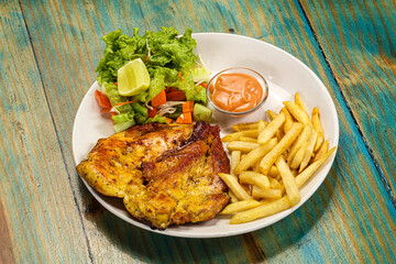 Grilled chicken fillet with french fried potato