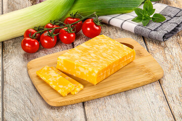 Marble yellow cheese with slices