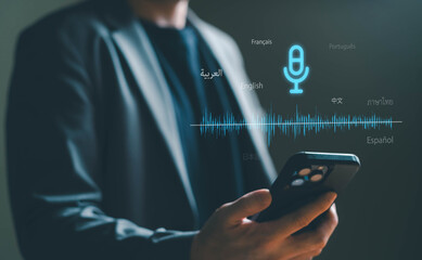 Business person using AI voice command with smartphone to create voice prompt for process automation without typing. Artificial intelligence for voice bot command technology.