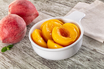 Sweet ripe yellow canned peaches