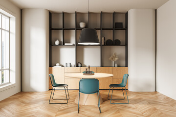 Modern dining room interior with round table, blue chairs, built-in shelving, and wood textures in minimalistic design concept. 3D Rendering. 3D Rendering