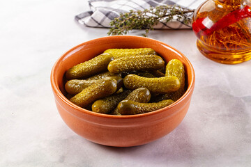 Marinated canned green cornichon cucumbers