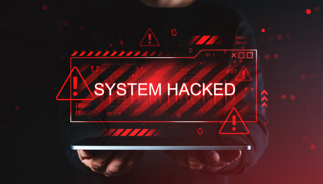 Digital warning graphic with "System Hacked" alert displayed above hands holding device, symbolizing online virus breach and cybersecurity threat concept.
