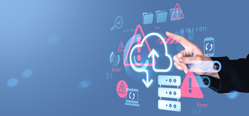 Hand pointing at cloud storage warning icons with cybersecurity error alerts on digital screen, representing online data risk and server failure concept.