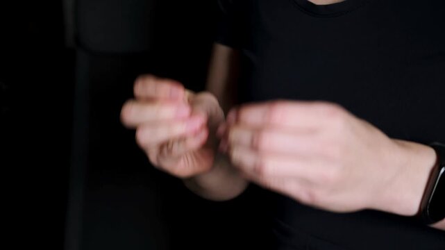 Snapping fingers with two hands. Close-up woman hands snap finger or clicks hands isolated on black background. Sound production. Professional musician beat. Body music. High quality 4k footage.