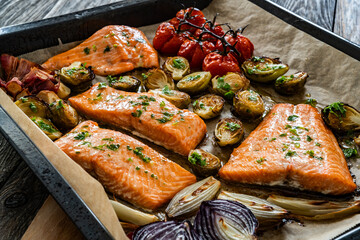 One sheet pan - roasted salmon fillet with vegetables  in baking tray