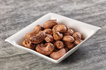 Unpeeled cashew nuts in the bowl