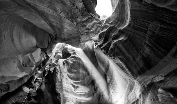 Stunning black and white photograph of Antelope Canyon with sculpted rock formations and textures