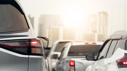 Rear side of grey car driving on the road. Enveronment traffic jam in the city with heavy pollution. Dense fog surrounds a major city. Cars lined up during rush hour.