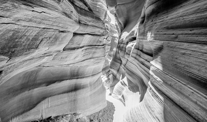 Stunning black and white photograph of Antelope Canyon with sculpted rock formations and textures