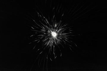 Fototapeta premium Broken glass. Damaged screen background texture. Cracks on a black screen.