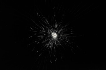 Fototapeta premium Broken glass. Damaged screen background texture. Cracks on a black screen.