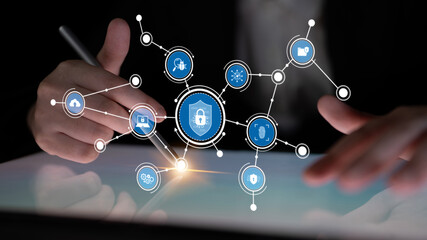 Hands interacting with a digital interface showcasing a lock symbol and various technology icons, emphasizing the importance of cybersecurity and data protection in today digital world. Tessel