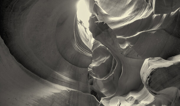 Stunning black and white photograph of Antelope Canyon with sculpted rock formations and textures