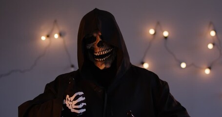 Frightening portrait of the evil grim reaper giving a thumbs up. The terrible and nightmare inducing skeleton figure adds a horror element, making it a striking and monstrous image.