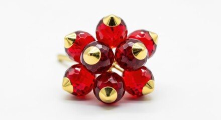 Close-up of red beads with gold caps on