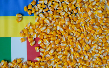 Сorn kernels, Ukrainian flag, and Italian flag. Ukraine-Italy trade relations.