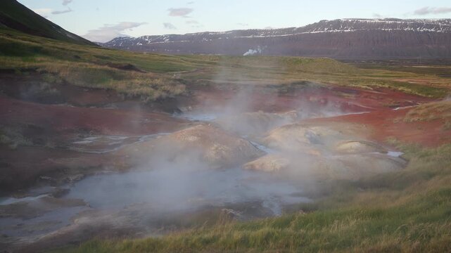 Mud pot, hot spring, fumarole in the landscape - north of Iceland