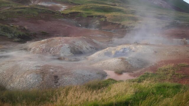 Mud pot, hot spring, fumarole in the landscape - north of Iceland