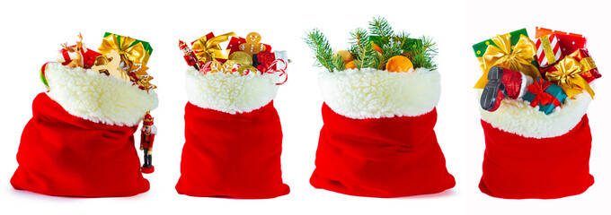 Set of red Santa sacks full of gifts, isolated on white background. © lizavetta